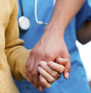 Young family member taking an elderly woman for special care - medical attention concept.